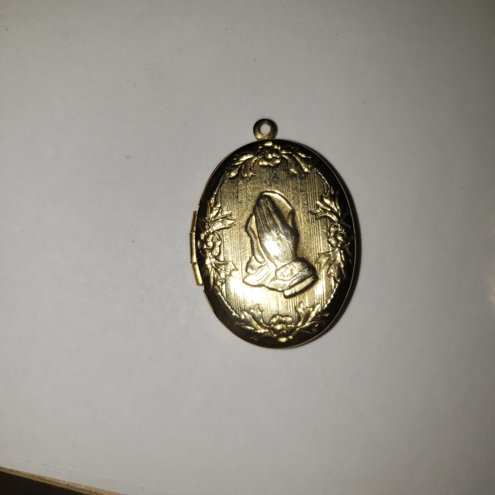 Praying hands locket